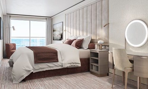 Schlafzimmer mit Bett und Blick auf Terrasse