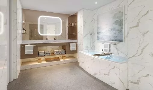 Badezimmer in Owner Suite - Badewanne und Marmorwände